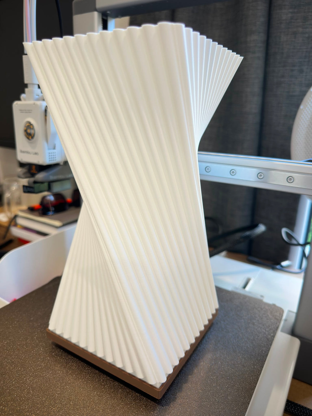 Twisted ribbed table lamp unlit, showing full sculptural form
